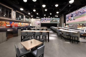 PT's Wings & Sports at The STRAT Hotel, Casino & SkyPod PT's Wings & Sports image of bar with viewing screens on the wall